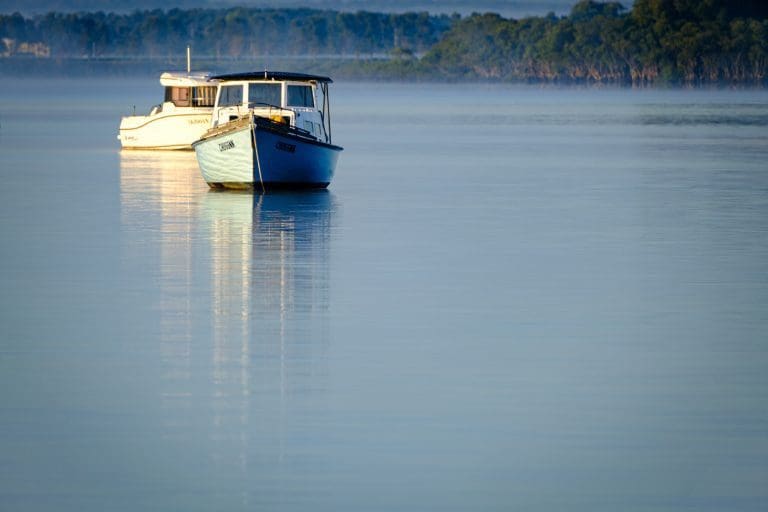 Shoalhaven Heads sunrise and a boats on the Shoalhaven River