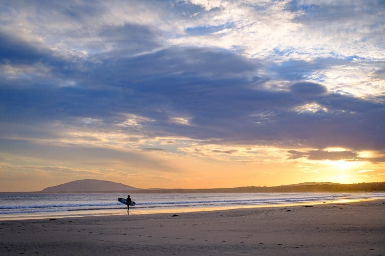 Surfer at Sunset at Gerroa landscape photography by Andy Hutchinson
